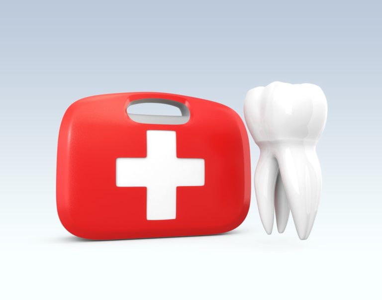 A red first aid kit next to a white tooth representing emergency dental care