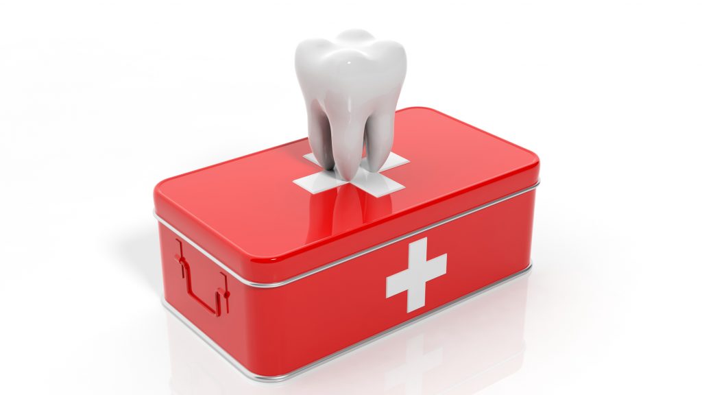 Illustration of a tooth on top of a red first aid kit